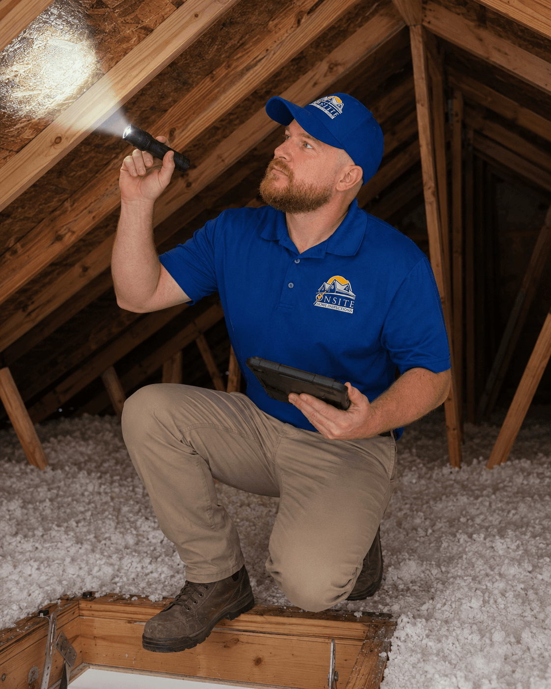 Inspector wearing PPE collecting a popcorn ceiling sample